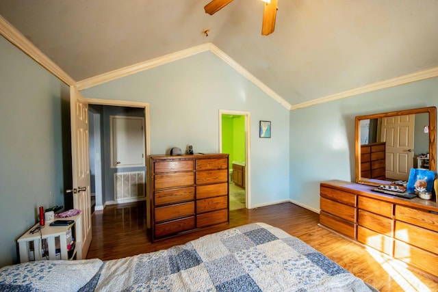 bedroom with ceiling fan, ornamental molding, dark hardwood / wood-style floors, and lofted ceiling