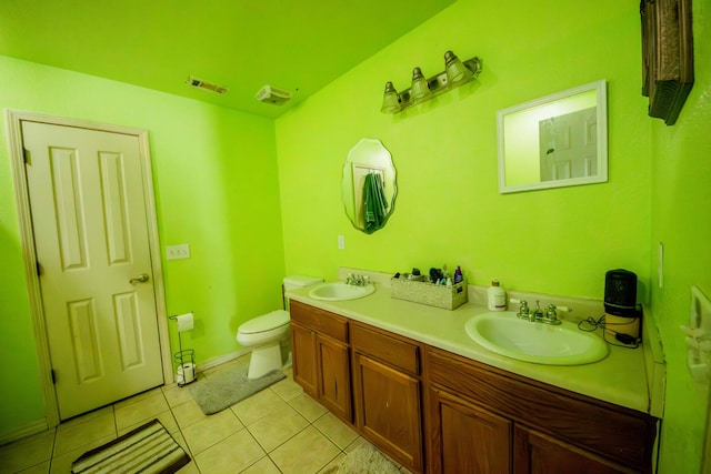 bathroom featuring vanity, toilet, and tile patterned floors