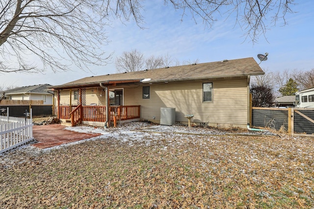 back of property featuring a patio and a wooden deck