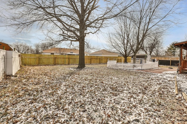 view of yard layered in snow