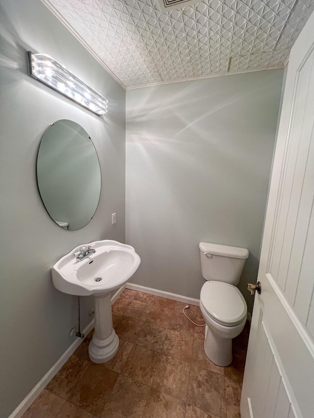 bathroom featuring toilet