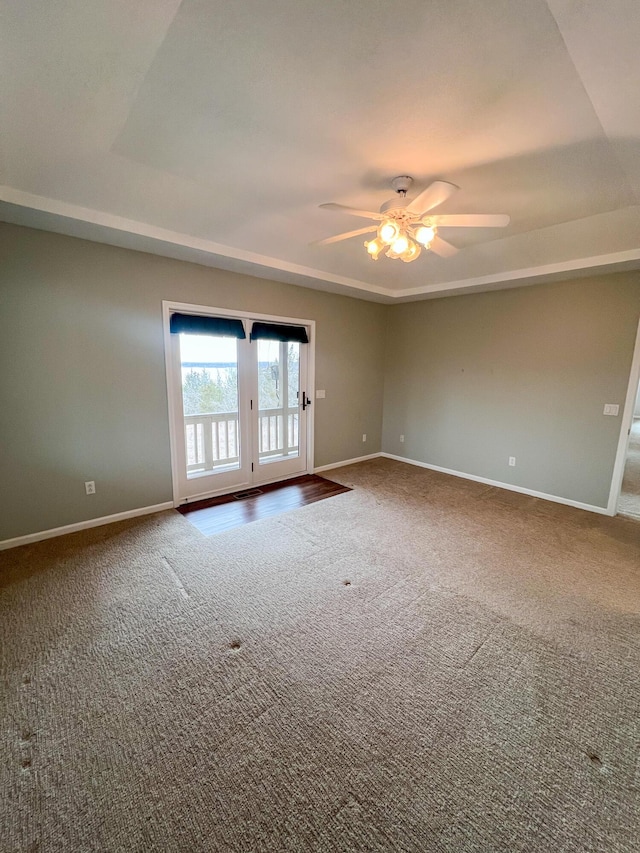 carpeted empty room with ceiling fan