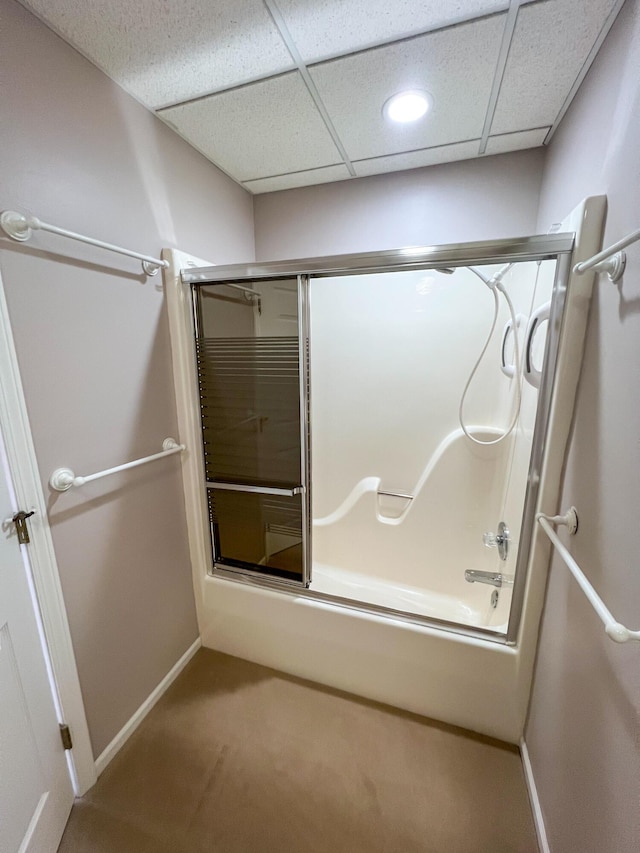 bathroom with enclosed tub / shower combo and a paneled ceiling