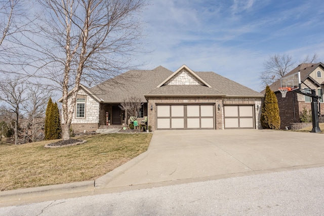 view of front facade with a front yard and a garage