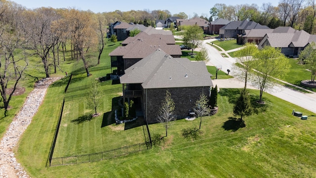 birds eye view of property with a residential view