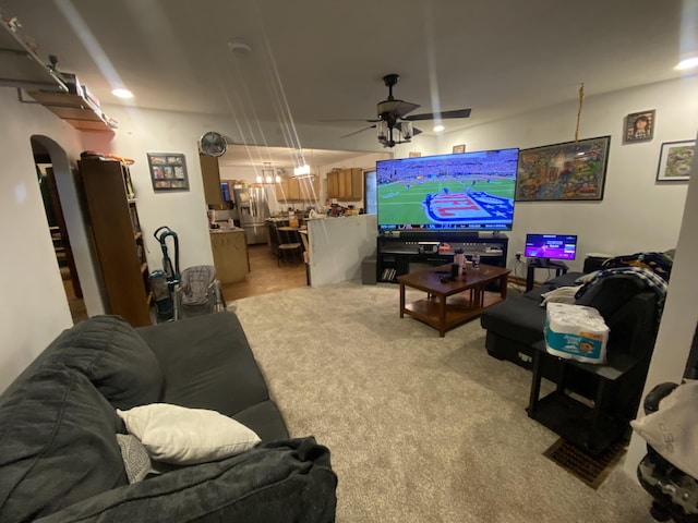 living room with ceiling fan and light carpet