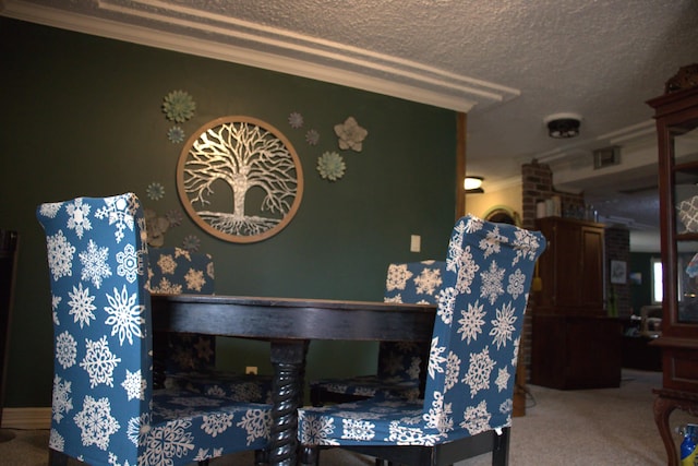 carpeted dining area with crown molding and a textured ceiling