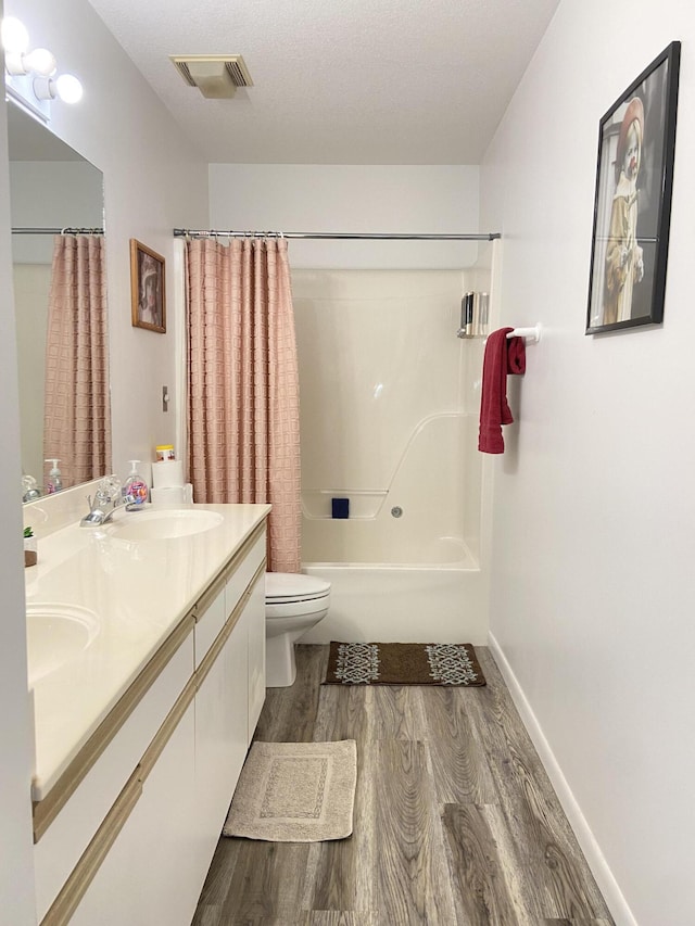 full bathroom featuring toilet, shower / tub combo, vanity, and wood-type flooring