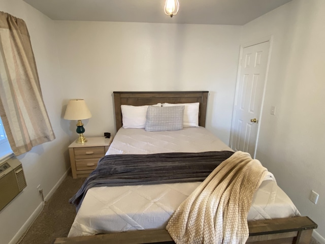 bedroom featuring dark carpet