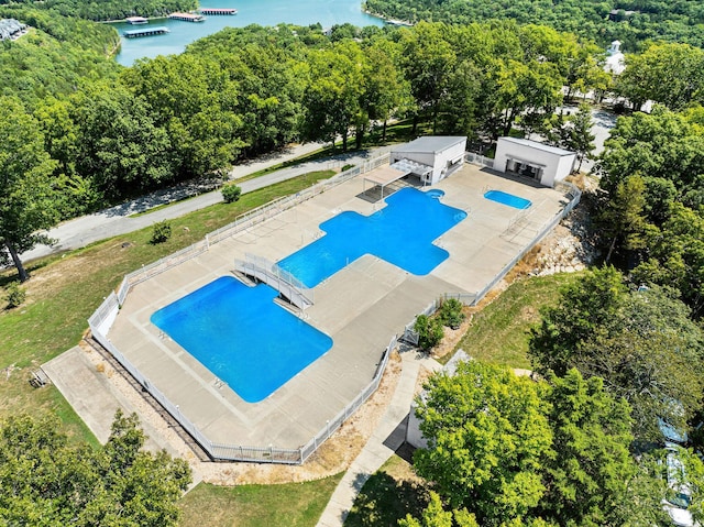 view of pool featuring a water view