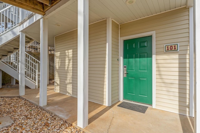 view of exterior entry featuring a porch