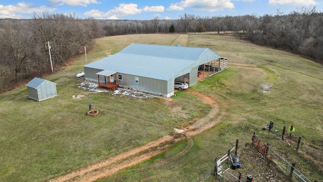 birds eye view of property with a rural view