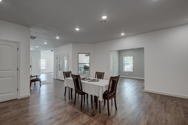 dining area with dark hardwood / wood-style floors