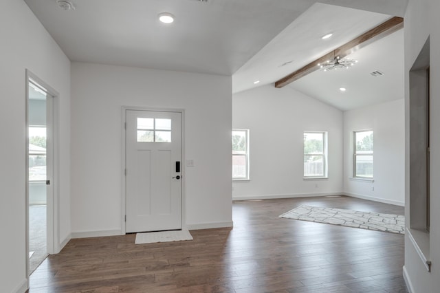 foyer entrance with vaulted ceiling with beams, an inviting chandelier, and dark hardwood / wood-style flooring