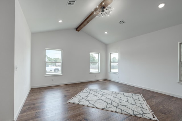 spare room with vaulted ceiling with beams and dark hardwood / wood-style floors