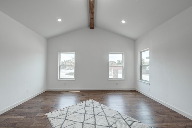 unfurnished room with dark hardwood / wood-style flooring, lofted ceiling with beams, and a healthy amount of sunlight