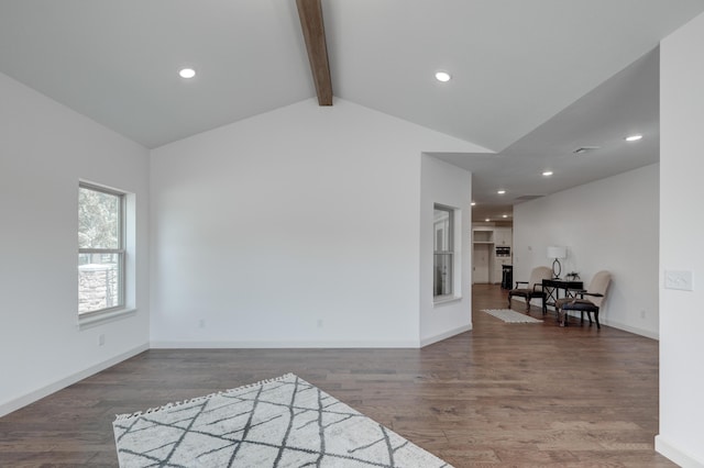 living room with vaulted ceiling with beams and dark wood-type flooring