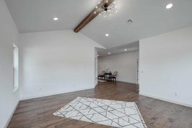 spare room featuring a chandelier, dark wood-type flooring, and lofted ceiling with beams