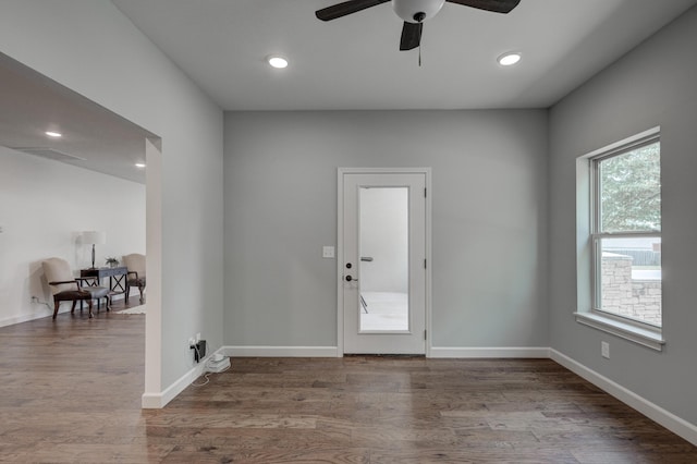 entryway with ceiling fan and wood-type flooring