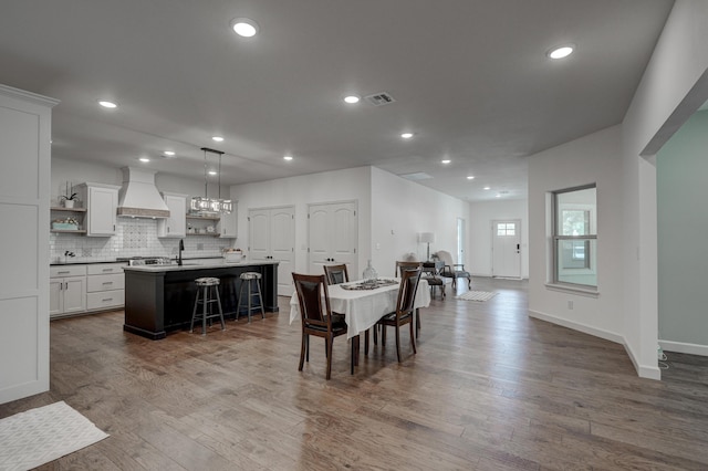 dining area with sink and dark hardwood / wood-style floors