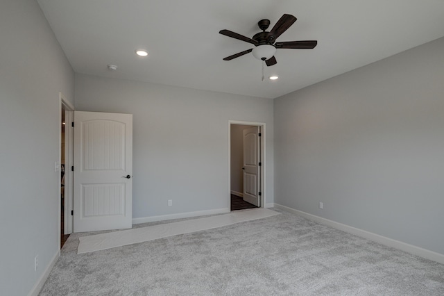 unfurnished bedroom with light carpet and ceiling fan