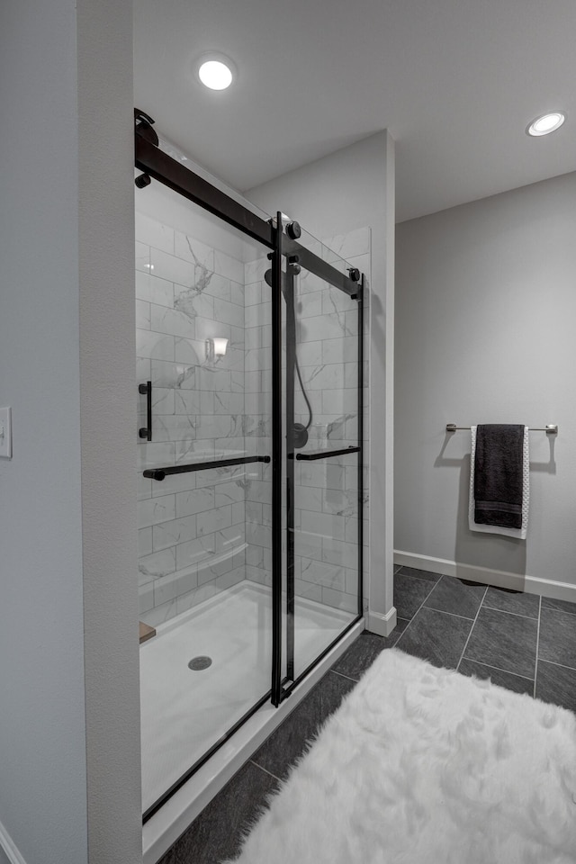 bathroom featuring tile patterned floors and an enclosed shower