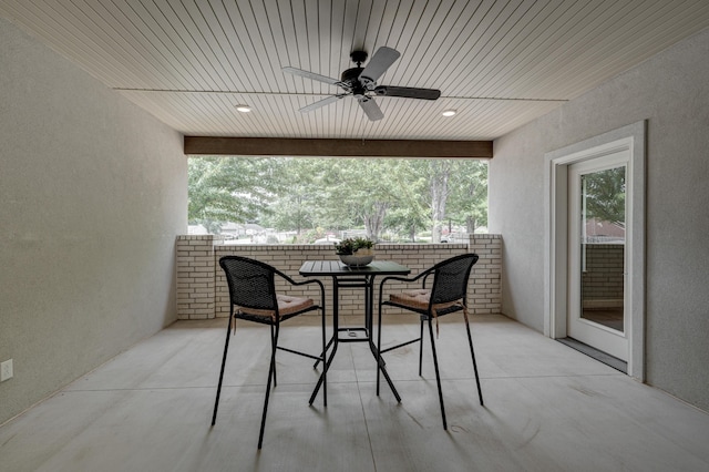 exterior space with a wealth of natural light, ceiling fan, and wood ceiling