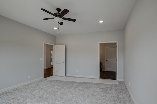 unfurnished bedroom with light carpet and ceiling fan