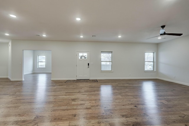 entrance foyer featuring ceiling fan, light hardwood / wood-style flooring, and a healthy amount of sunlight