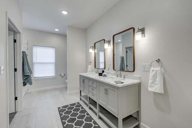 bathroom with toilet and vanity