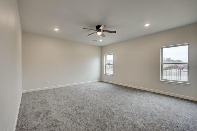 carpeted empty room with ceiling fan