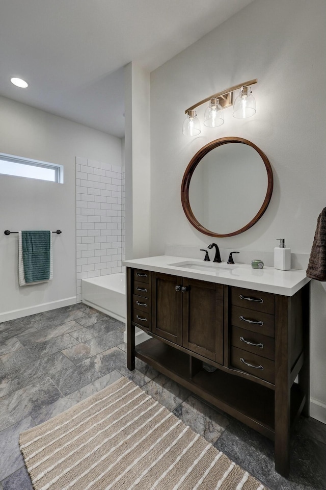 bathroom with a bathing tub and vanity