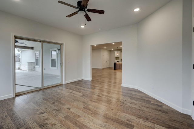 spare room featuring ceiling fan and wood-type flooring