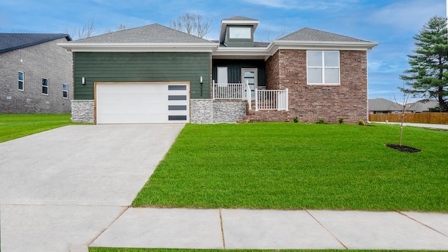 view of front facade with a front yard and a garage