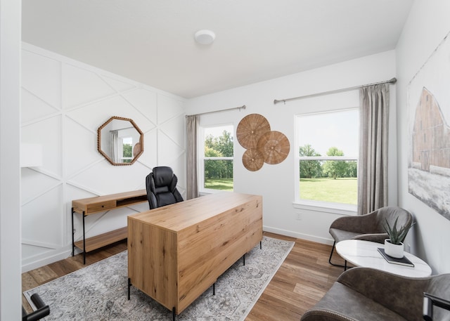 office with hardwood / wood-style flooring