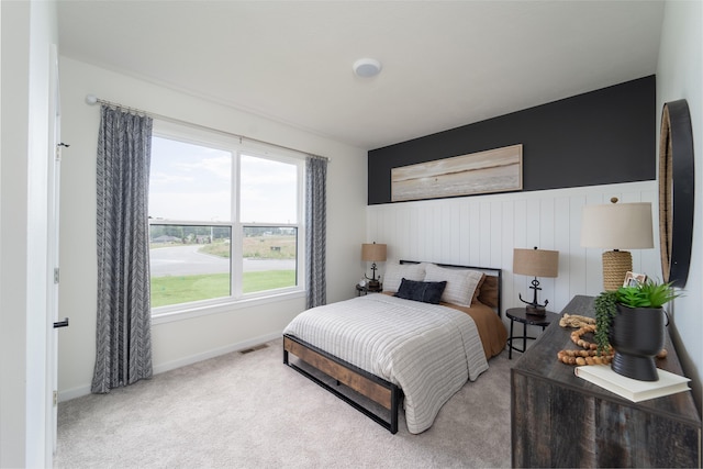 bedroom with light colored carpet