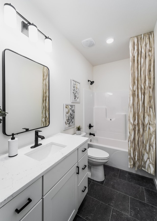 full bathroom with shower / tub combo with curtain, vanity, and toilet