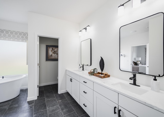 bathroom with a bath and vanity