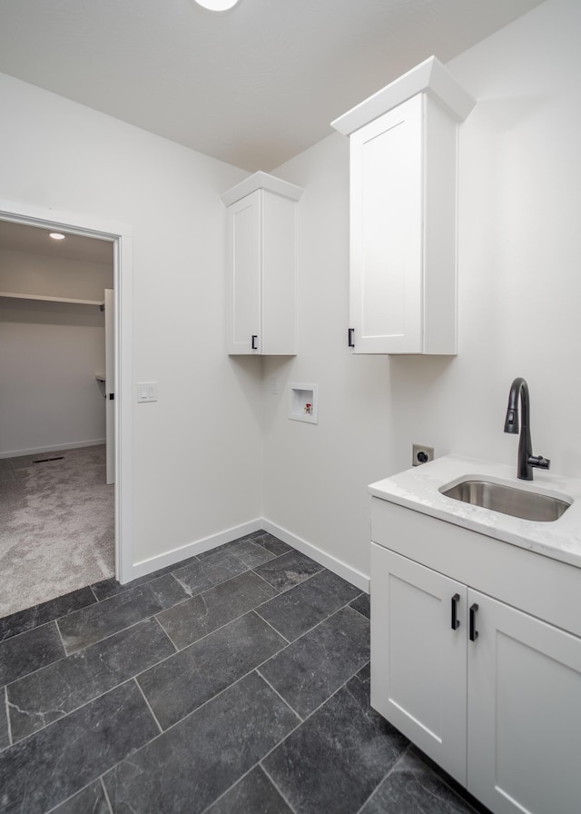 laundry area with washer hookup, cabinets, sink, and electric dryer hookup