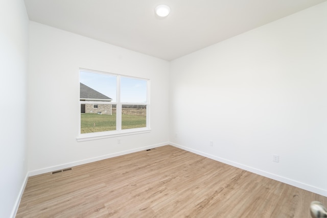 spare room with light hardwood / wood-style floors