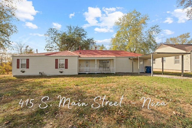 exterior space with covered porch, a carport, and a front lawn