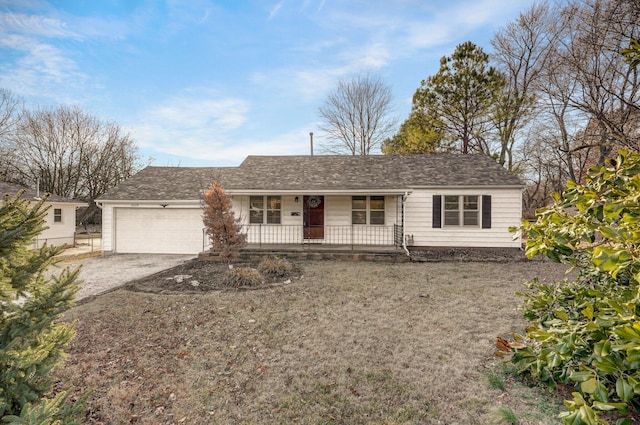 ranch-style house with a garage, driveway, and covered porch