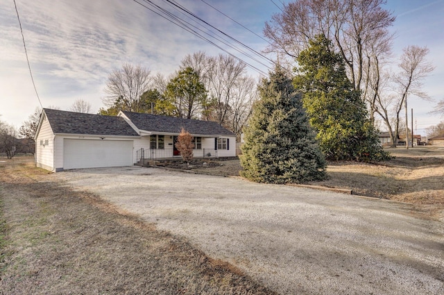 ranch-style home with driveway and an attached garage