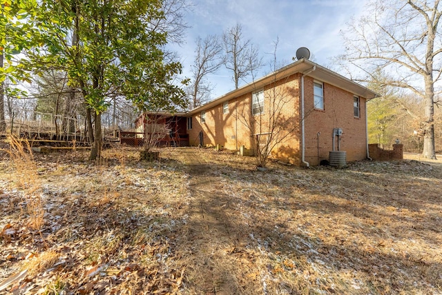 view of home's exterior featuring brick siding