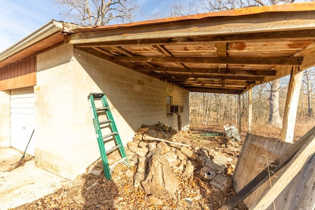 exterior space with concrete block siding