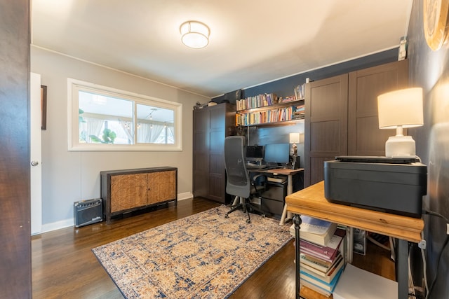 office with baseboards and dark wood-style flooring