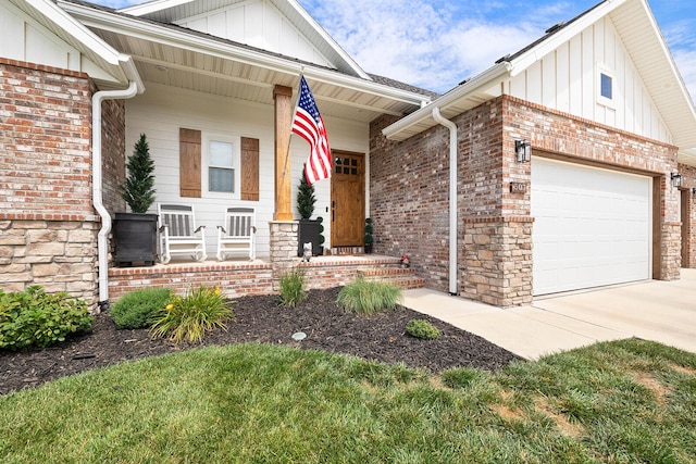 view of front of property featuring a garage, covered porch, board and batten siding, and brick siding