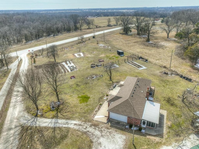 birds eye view of property with a rural view