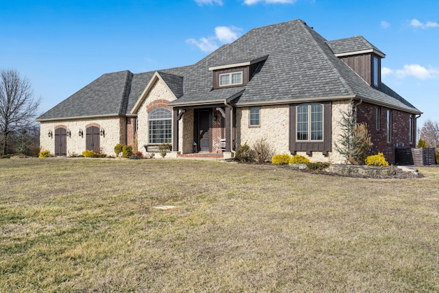 view of front of house with stone siding and a front lawn