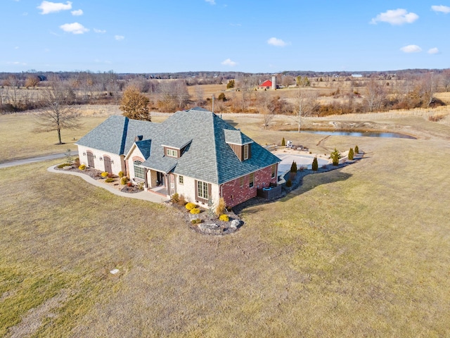 birds eye view of property featuring a rural view